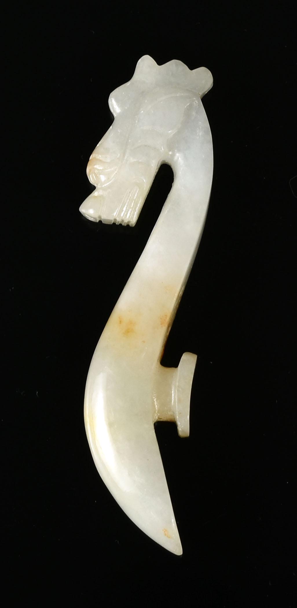 81mm Chinese Jade Dragon Belt Hook: Excellent surface polish on this Dragon Belt Hook from China. Pale green nephrite with russet tones running through the center. Very attractive with detailed carving.
