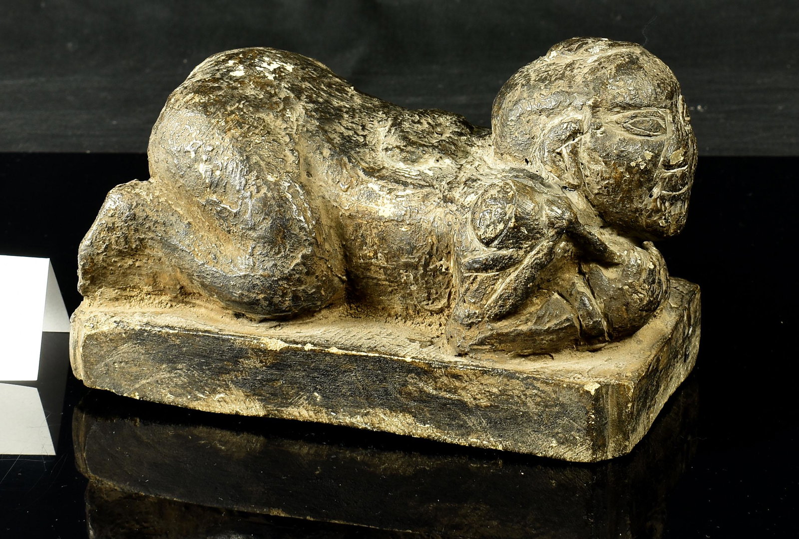 Chinese Ming Dynasty Carved Hardstone Pillow: A fine ancient figural stone carving that actually functions as a very comfortable pillow when placed under ones neck when reclined on their back. Dates to the Ming Dynasty circa 1500 A.D. Excellent d