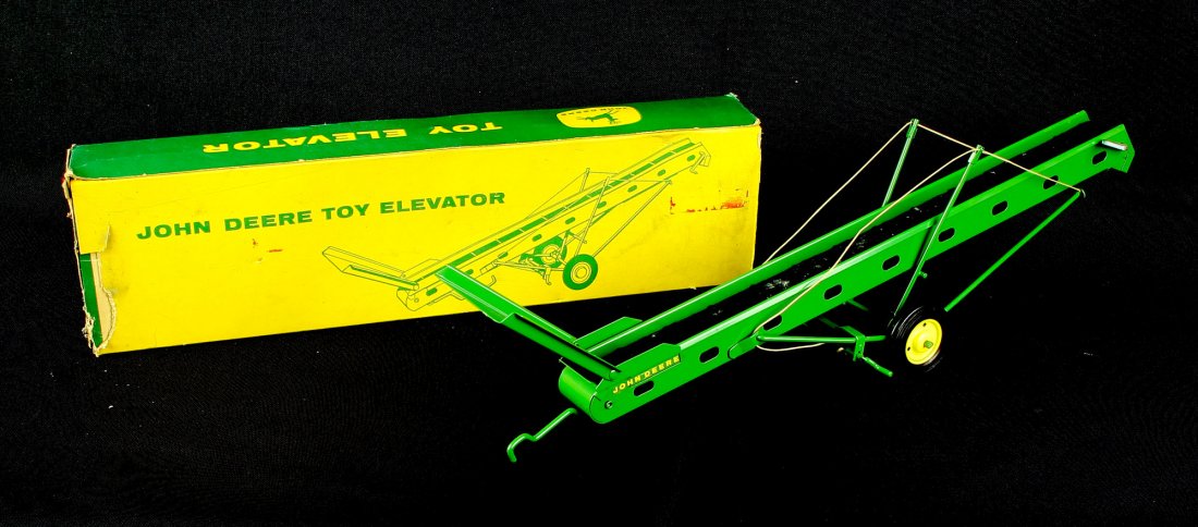 Vintage 1950's John Deere Toy Elevator with Original: In excellent condition with all original control lines and belt. Virtually New in box. From the Nick Hadden Collection of Vintage Toys and Models.