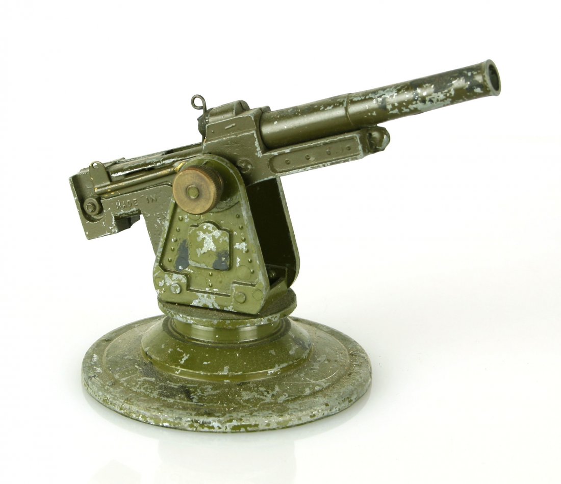 Vintage 'Super Bullock Gun' Anti-Aircraft Gun WORKING: Bullock Model - Long Range Anti Aircraft Gun, comprising: pedestal mounted 3.7" AA Gun with elevating screw, firing mechanism Paint loss otherwise in Fair Condition. Original [M.S.R. Toys] illust