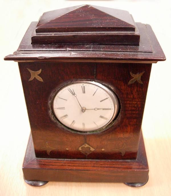 SILVER PAIR CASED WATCH IN WOOD CASE: A silver pair cased pocket watch by Robert Fletcher , Chester, No 1172, the ivory enamel dial, 44mm, printed with Roman numerals, the plain cases marked for Chester 1832, contained in a mahogany clock