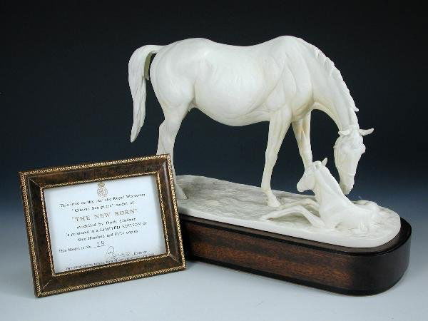 ROYAL WORCESTER 'THE NEW BORN' LIMITED EDITION: A Royal Worcester model of 'The New Born' by Doris Lindner, number 19 in a limited edition of 150, mounted on a mahogany plinth base and together with its leather framed certificate of authenticity, p