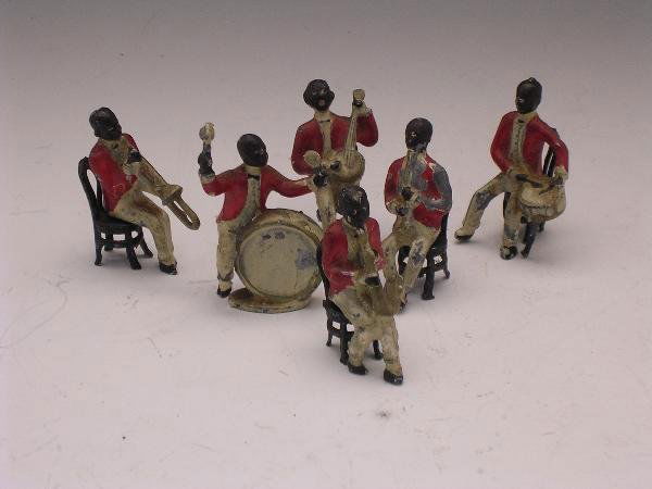 PAINTED MODEL LEAD JAZZ BAND WITH SIX FIGURES AND: Painted model lead jazz band with six figures and five Thonet type chairs, some paint loss and chipping circa 1930s, unmarked (11)