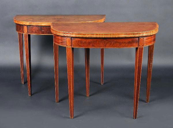 A MATCHED PAIR OF GEORGE III MAHOGANY TEA TABLES: A matched pair of George III mahogany tea tables, each with shaped crossbanded fold over top above a plain frieze, standing on square section tapering legs, 92cm wide, 45cm deep, 75cm high