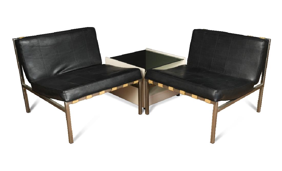 Robin Day for Hille, a pair of black leather Gatwick: Robin Day for Hille, a pair of black leather Gatwick chairs, with satin aluminium box frames, together with a white laminate and smoke glass coffee table (3) 66 x 71 x 75cm (26 x 28 x 29in)