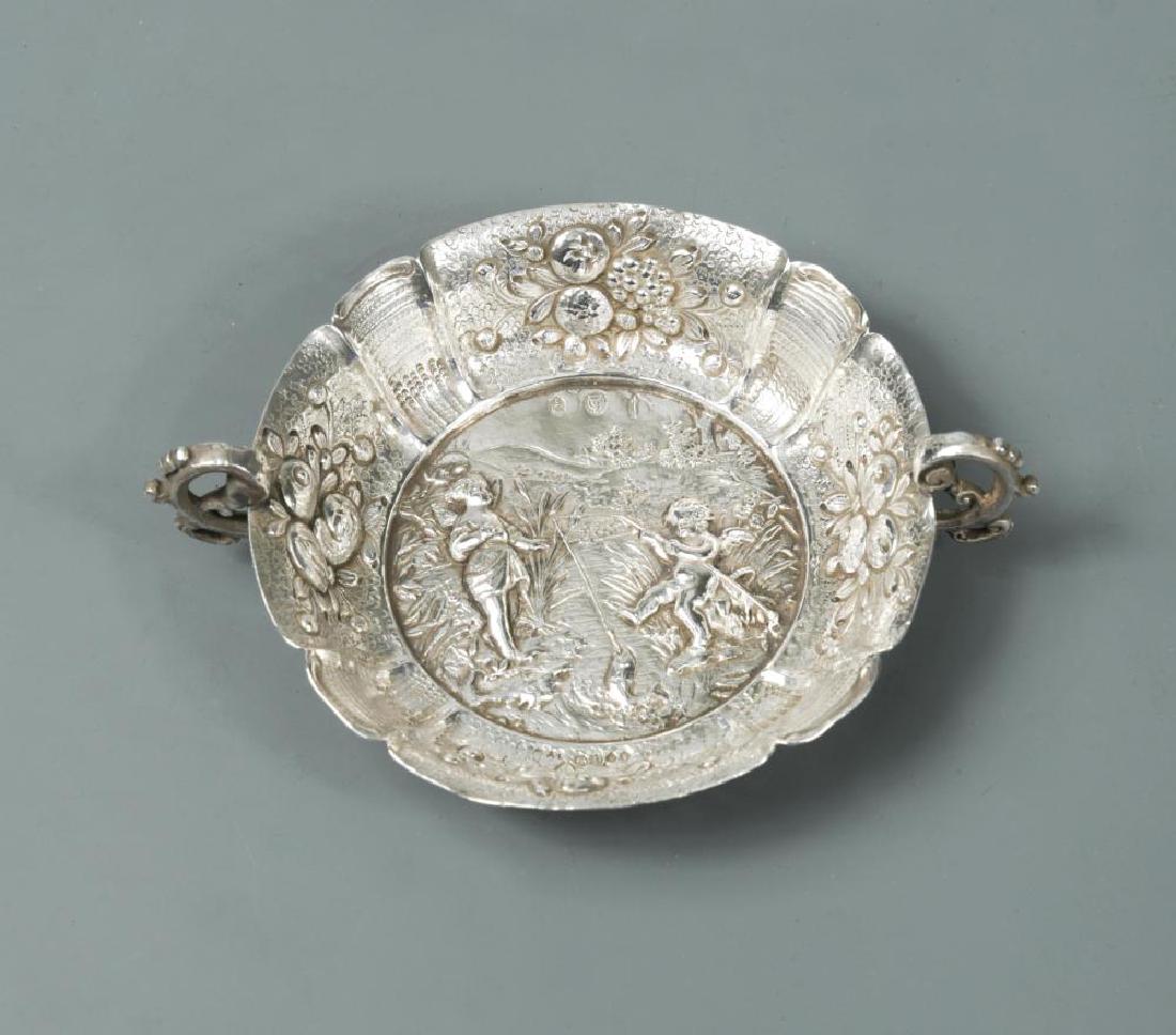 A Victorian silver two handled tastevin, (1 of 4)