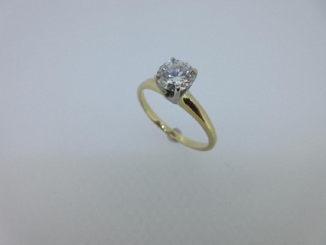 A single stone diamond ring, (1 of 4)