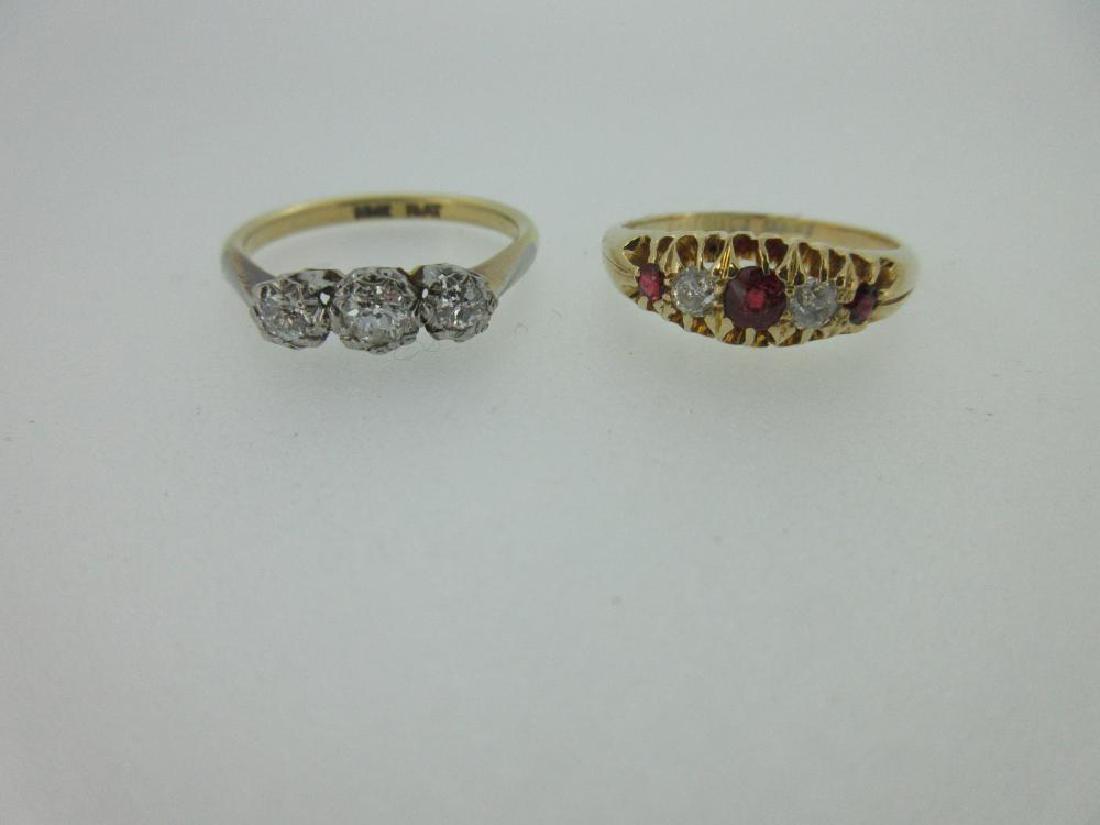 A diamond three stone ring and a ruby and diamond five (1 of 10)