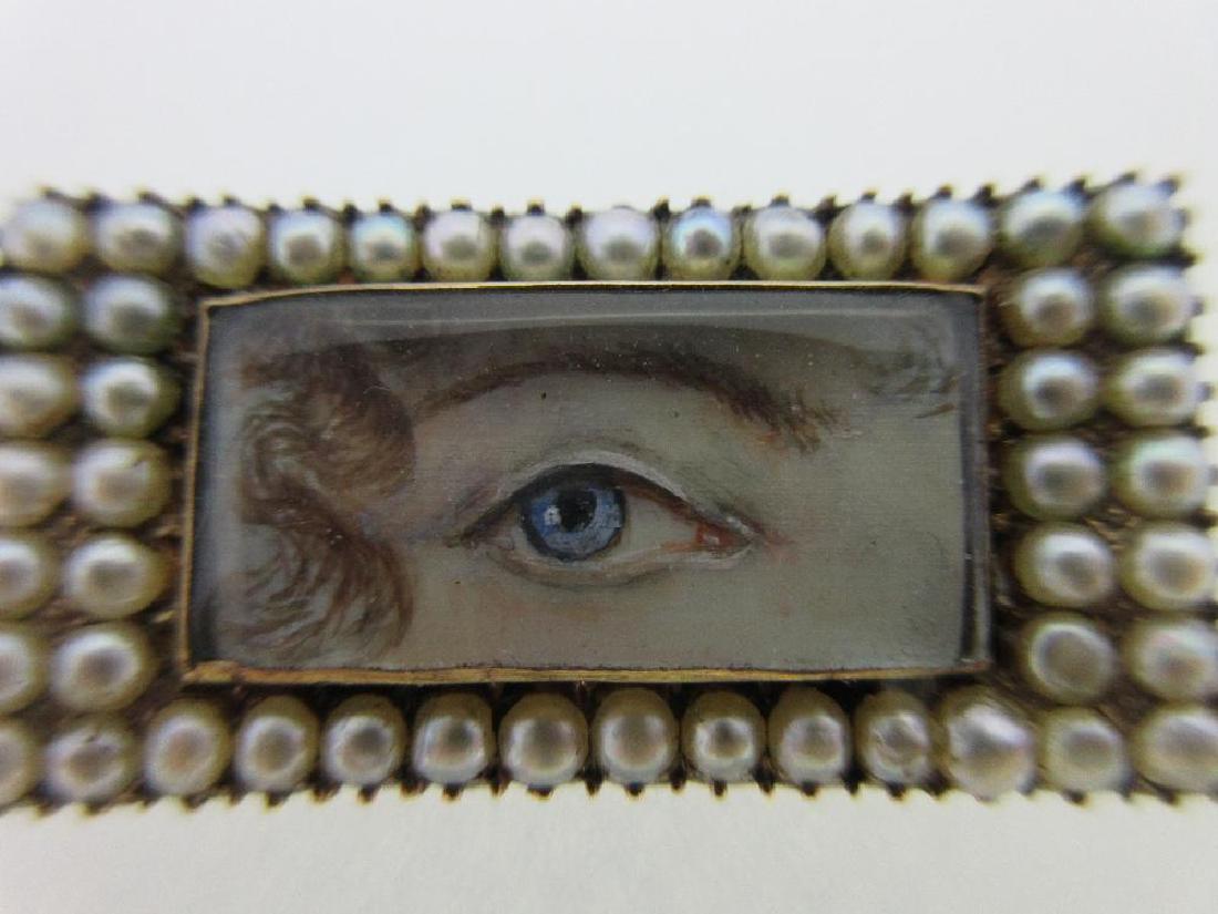 A pearl set lover's eye brooch, (1 of 5)
