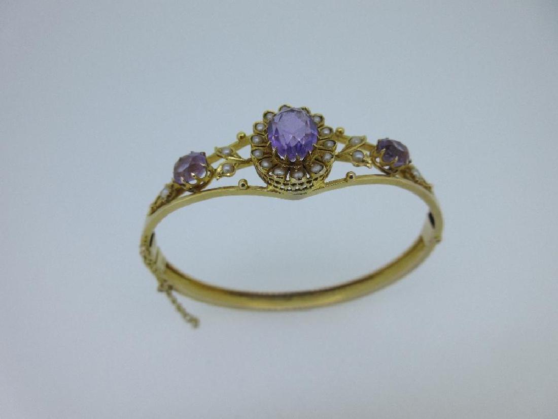An amethyst and seed pearl set hinged bangle, (1 of 6)