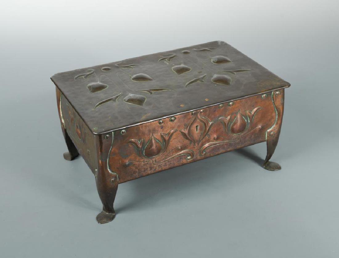 An Arts & Crafts copper table casket by James Smithies,: An Arts & Crafts copper table casket by James Smithies, Wilmslow, 1900, the repoussé box and hinged cover embossed with stylised foliate motifs, inscribed to base 12.50 x 26 x 17cm (5 x 10 x 7in)