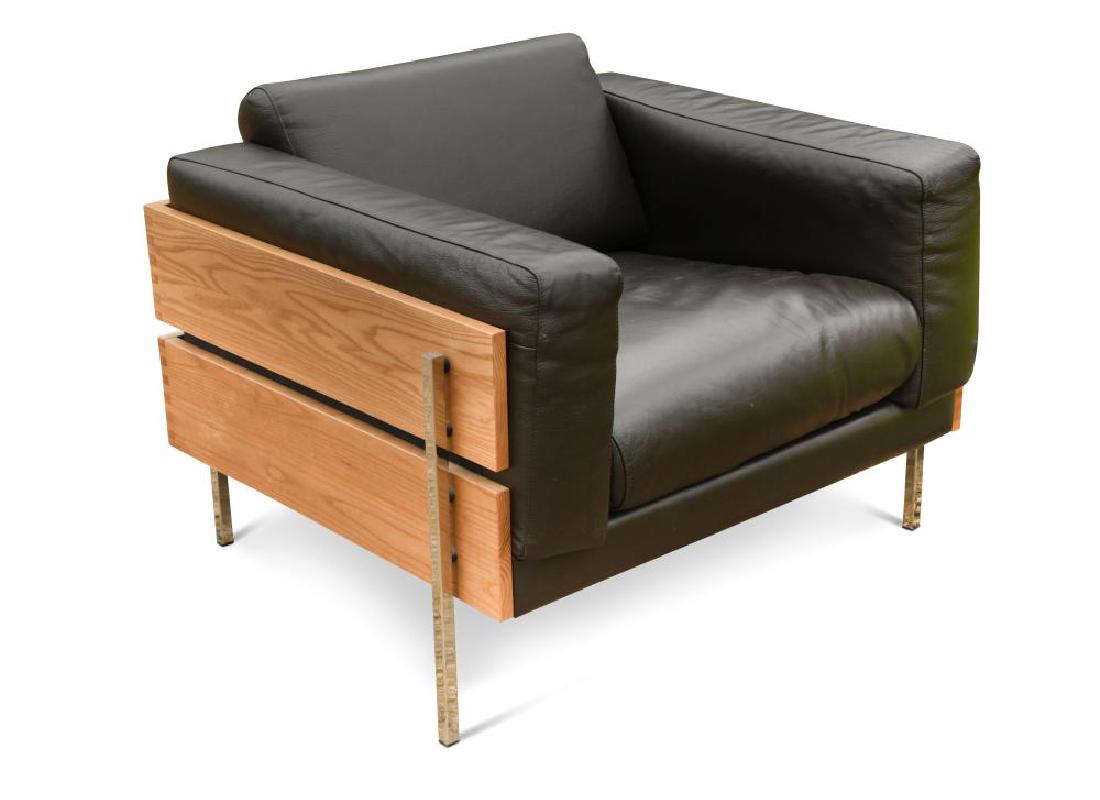 Robin Day for Habitat, a Forum club armchair,: Robin Day for Habitat, a Forum club armchair, originally designed 1964, with black leather upholstery raised on box tube chrome legs 62 x 90 x 86cm (24 x 35 x 34in)