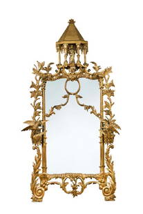 A Rococo revival gilt wood framed pier glass,: A Rococo revival gilt wood framed pier glass, carved in the Chinese Chippendale manner with pagoda cresting and ho-ho birds 170 x 79cm (66 x 31in)