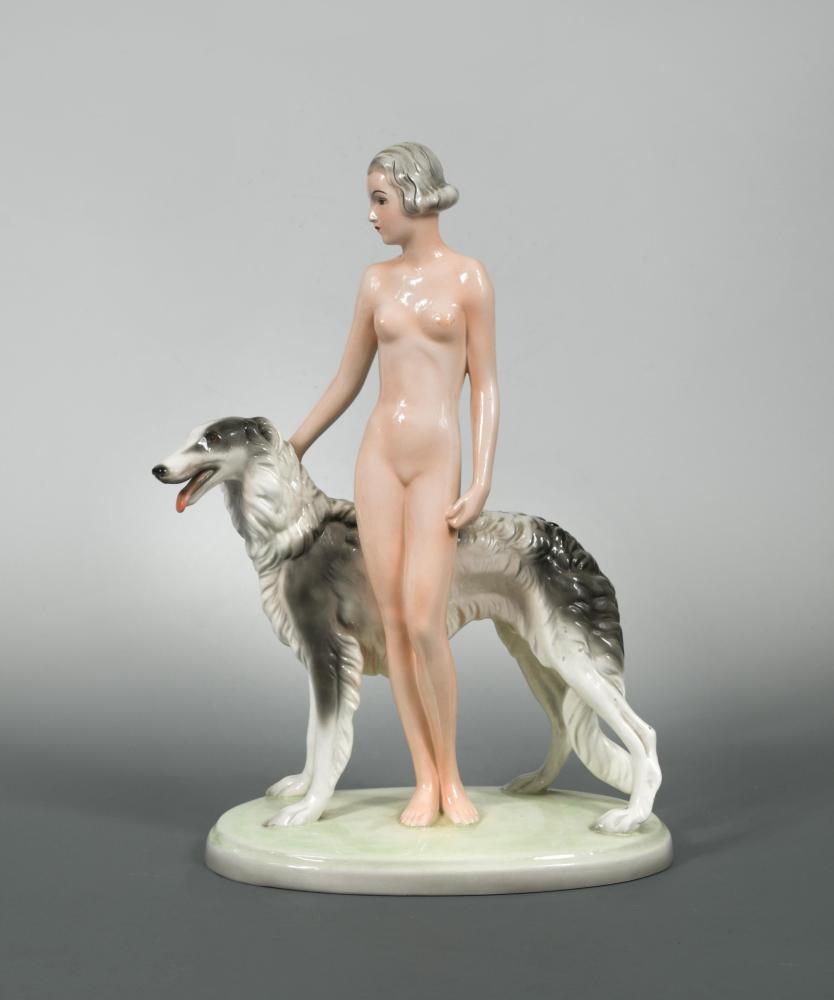 A Joesef Schuster model of a female nude with a Borzoi,: A Joesef Schuster model of a female nude with a Borzoi, probably designed by Josef Lorenzl, printed and impressed marks, including model number 7463 155 31 39 x 26cm (15 x 10in) In good condition with