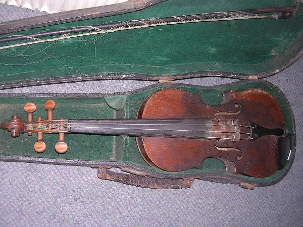 A CASED VIOLIN AND BOW, 1870 OF GLASGOW: 'John Crawford, 124 North John Street, Glasgow ... 1870' a cased violin and a bow, the back well figured, 60cm long, the bow unsigned.