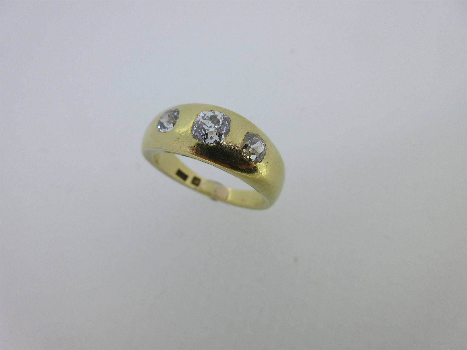A three stone diamond 'gypsy' ring, (1 of 6)