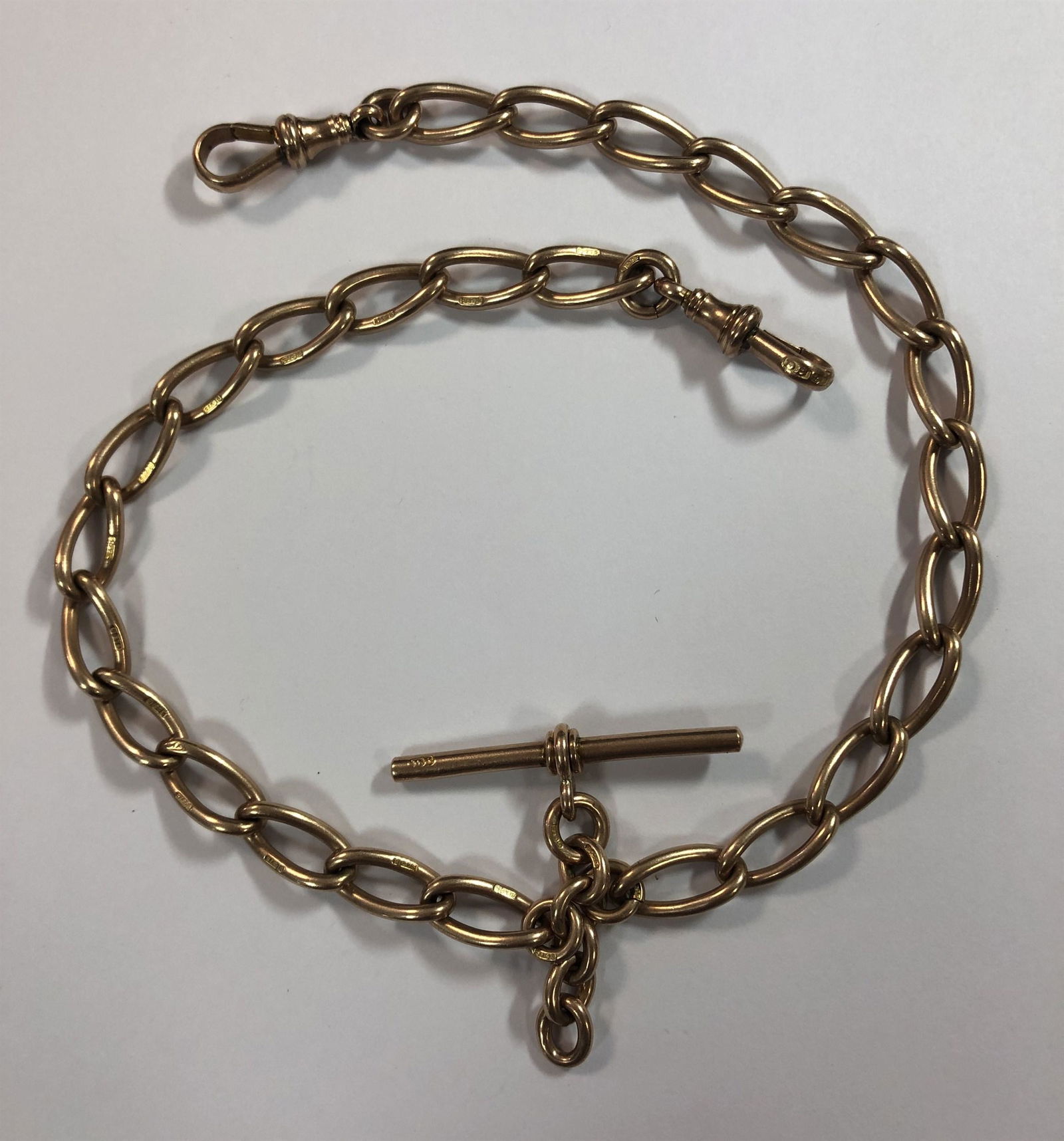 An Edwardian 9ct rose gold double Albert watch chain, (1 of 5)