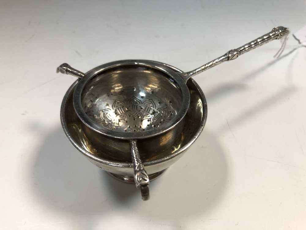 A George V silver tea strainer by Liberty & Co., (1 of 4)