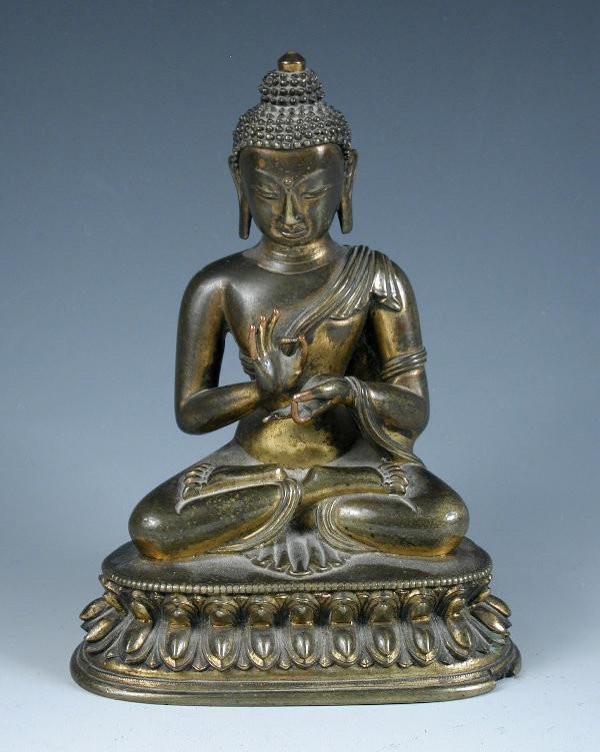 A GILT BRONZE TEMPLE FIGURE