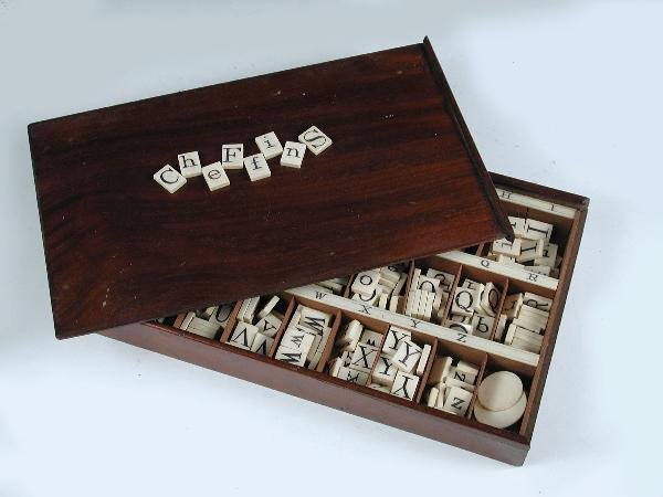 A VICTORIAN MAHOGANY BOX OF ALPHABET LETTERS