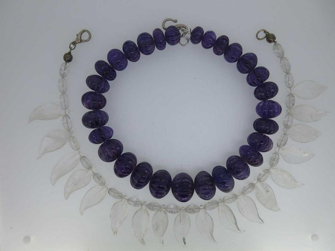 A necklace of carved amethyst beads and another of (1 of 9)