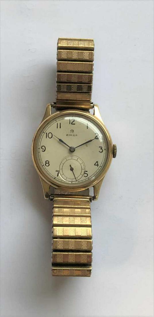Omega - A gentleman's 9ct gold wristwatch,: c1951, the signed cream coloured dial, 30mm diameter, with black Arabic numerals, blued hands, subsidiary seconds register and chemin de fer chapter ring, signed 15 jewel mechanical crown wind movemen