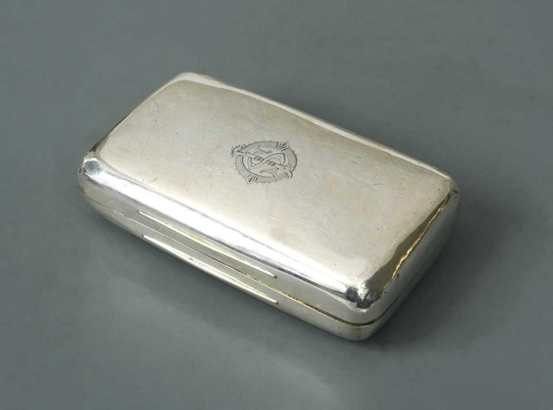 A Victorian silver pocket cigar case,: by Thomas Johnson I, London 1876, of rectangular form with turned corners, the piano hinged friction fitting cover engraved with a belted monogram, 6.8ozt