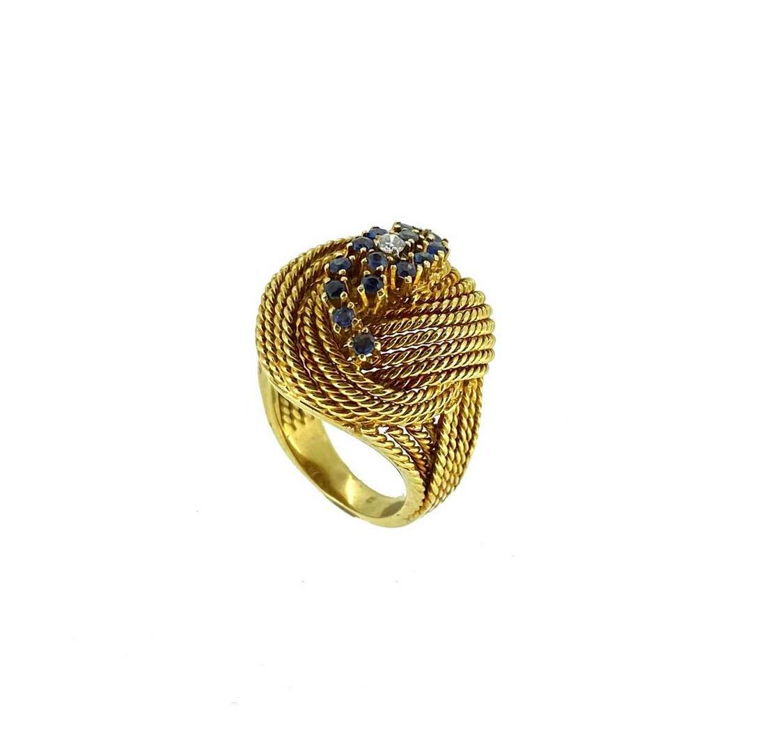 A late 20th century sapphire and diamond knot style ring, (1 of 4)