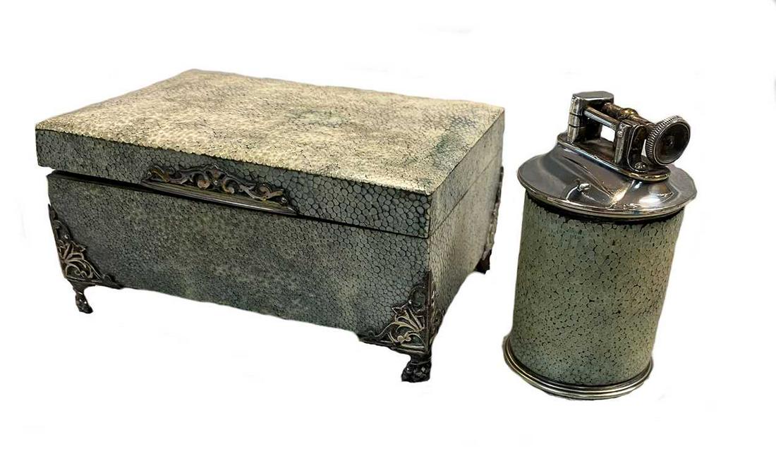 An early 20th century silver mounted shagreen covered table cigarette box with lighter en suite,: the wooden rectangular box covered in green stained shagreen with silver gilt piano hinge and pierced silver mounted corners and thumbpiece, mark of Charles & Richard Comyns, London 1926, 14 x 9.5cm,