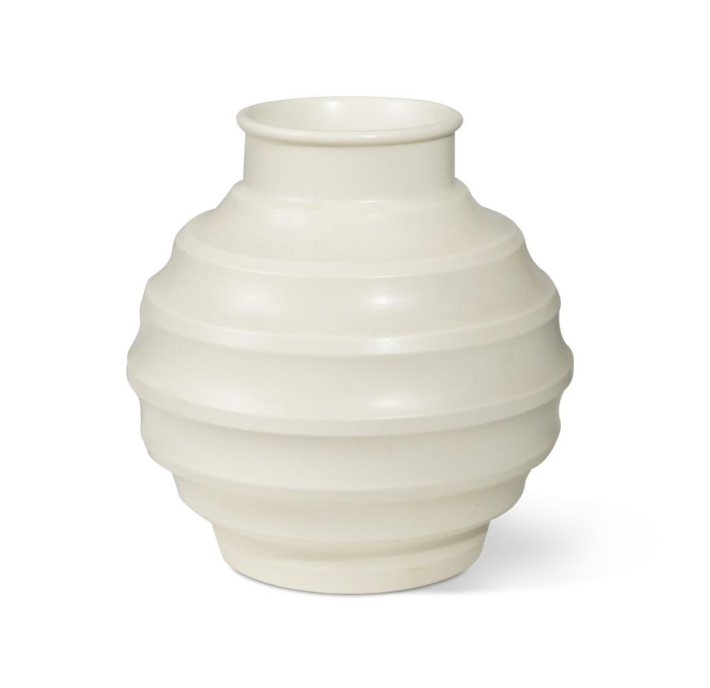 Keith Murray for Wedgwood, a Moonstone 'football' vase,: of globular form with concentric ribs, printed marks to underside 19cm highWith some stained crazing, a glaze imperfection to the body.