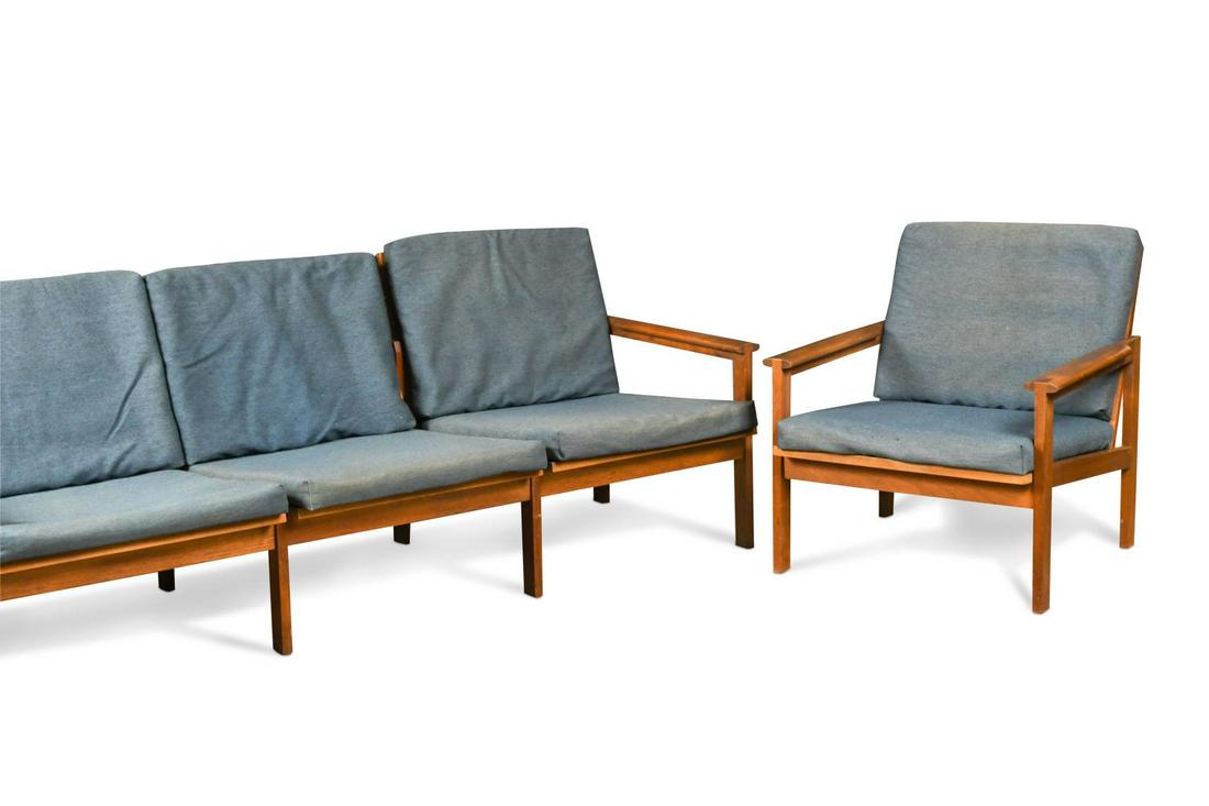 Illum Wikkelso for Niels Eilersen, a Danish teak Capella sofa and matching armchair, 1960s,: both with their original blue wool cushions the sofa 70 x 190 x 70cm