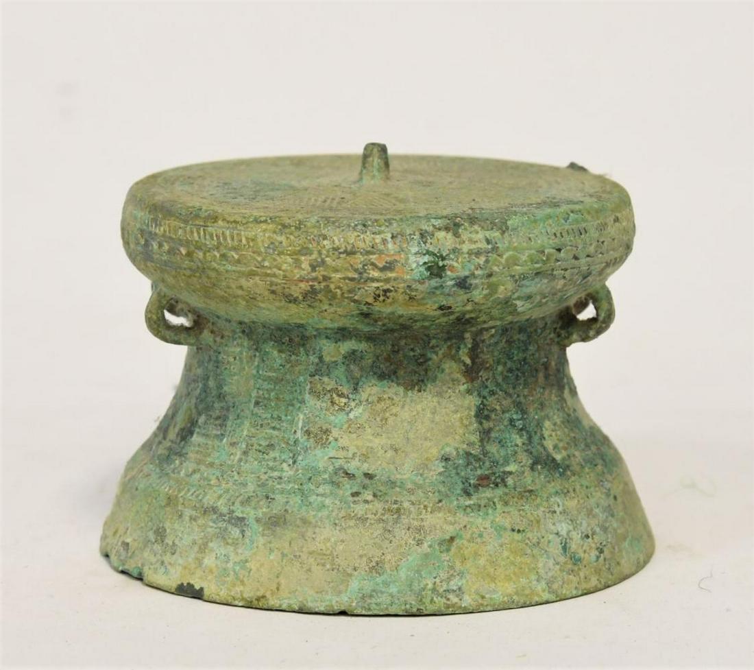 A Cambodian bronze drum/bell, 10th-12th century,: A Cambodian bronze drum/bell, 10th-12th century, 6cm high x 9.5cm diameter