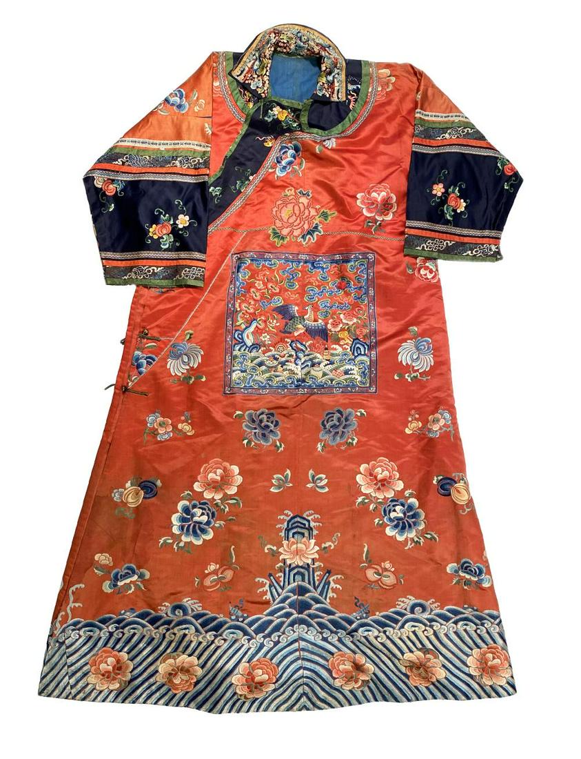 A Chinese embroidered red silk robe, late Qing Dynasty, circa 1900, (1 of 4)