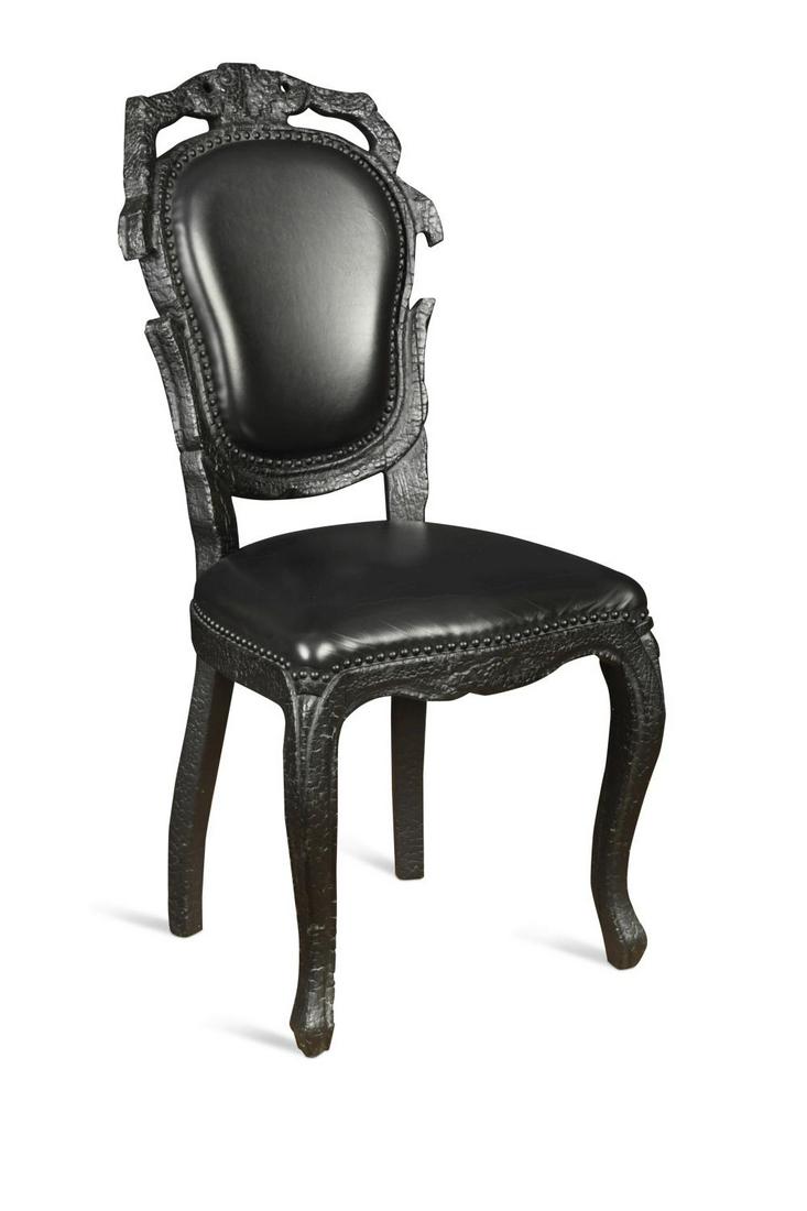 § Maarten Baas (1978-) for Moooi, a Smoke chair, 2004,: § Maarten Baas (1978-) for Moooi, a Smoke chair, 2004, burnt wood finish with resin and black leather upholstery, labelled to underside 104cm high