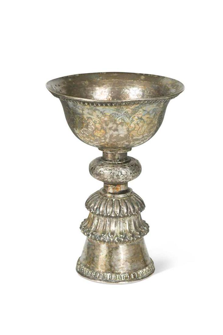 A Tibetan silver votive butter lamp, 18th/19th century, the ogee bowl is engraved with three panels (1 of 7)