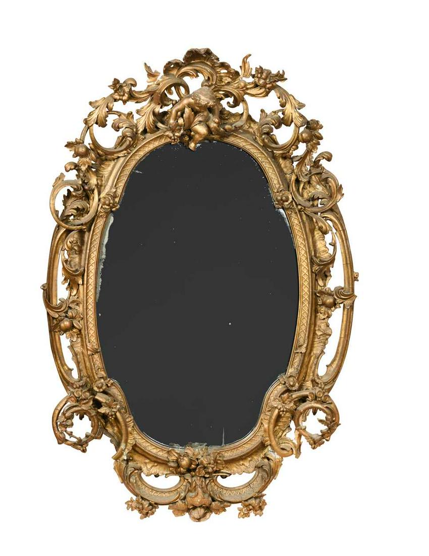 An oval Victorian gilt and gesso wall mirror, surmounted with a cherub holding a bunch of grapes, (1 of 1)