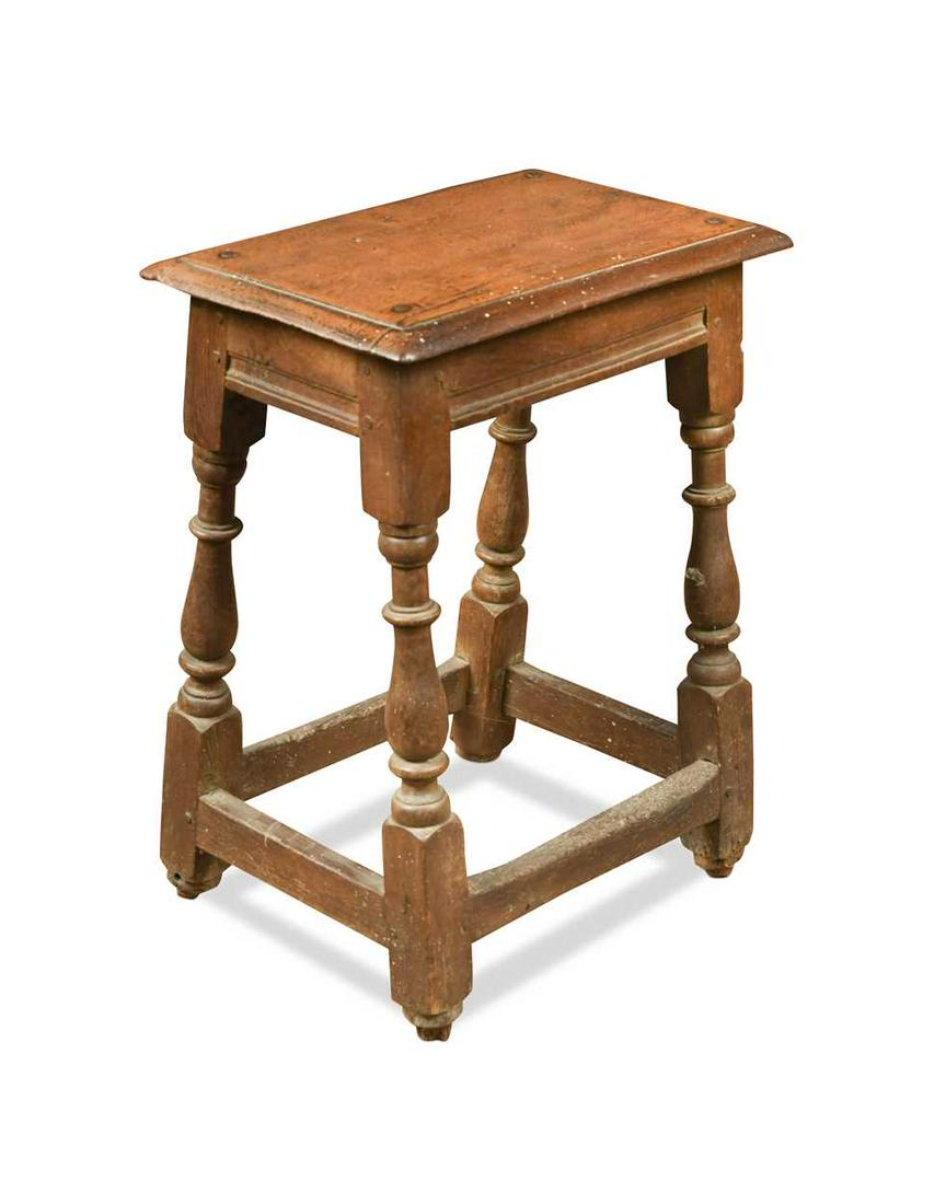 An oak joint stool, 17th century and later,: An oak joint stool, 17th century and later, the rectangular moulded seat above a run moulded frieze raised on turned legs united by a peripheral stretcher 53 x 43 x 27cm Provenance: Collection of Mike