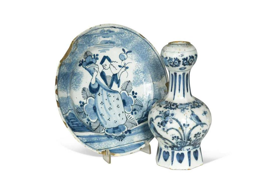 A Delft blue and white bottle vase, circa 1700,: A Delft blue and white bottle vase, circa 1700, the ovoid body decorated with birds, on an octagonal base, GK mark for Gerrit Pietersz Kam of Drie Postelyne Astonne Factory, or De Paeuw Factory 17cm h