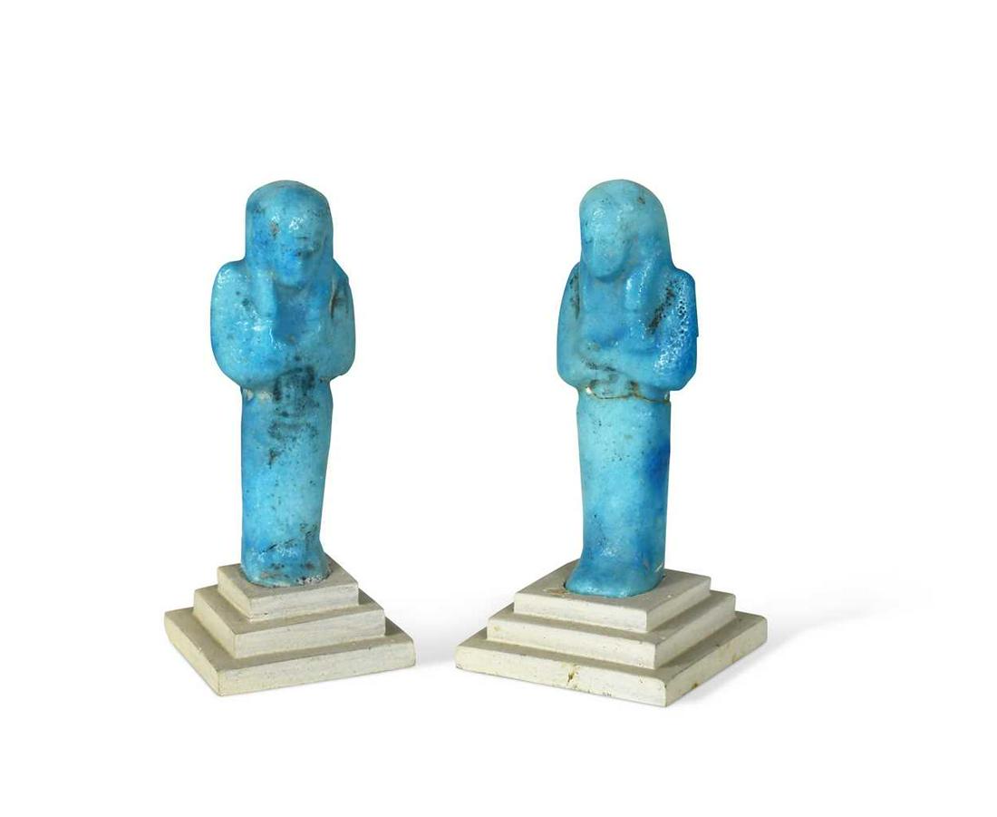 Two Egyptian bright blue faience shabti figures,: Two Egyptian bright blue faience shabti figures, probably third immediate period circa, 1069 - 715BC, both inset on stands 10.5cm highProvenance: Collection of Herbert Warner and by family descent