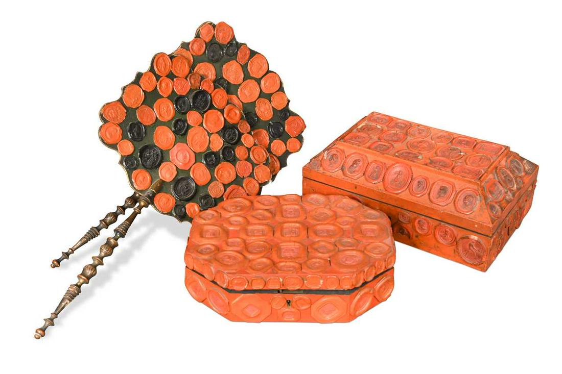 Two decorative caskets applied with red wax seals, 19/20th century,: Two decorative caskets applied with red wax seals, 19/20th century, the rectangular box with mainly classically inspired seals, a mirror to the lid underside, the octagonal example with mainly armoria