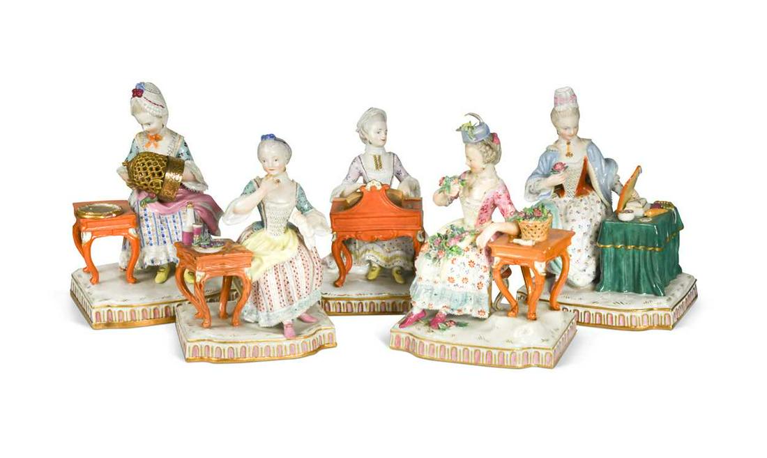 A set of five Meissen ladies seated stimulating their senses,: A set of five Meissen ladies seated stimulating their senses, one smelling a rose taken from the basket beside her on a table, another eating and drinking, one looking at the mirror on her dressing ta