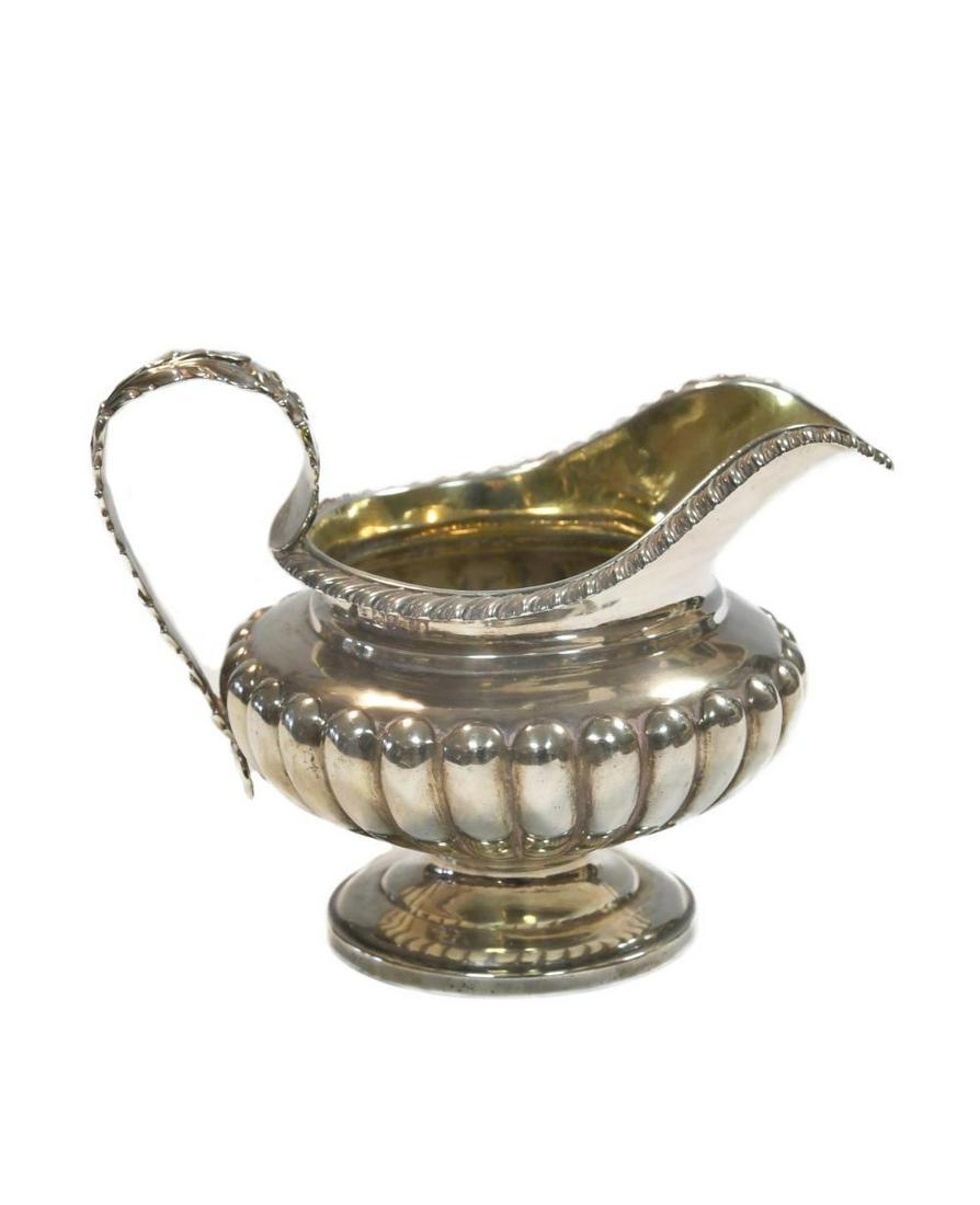 A Victorian silver cream jug, mark of Charles Fox II, London 1837, of squat form, lower gadrooned, (1 of 4)