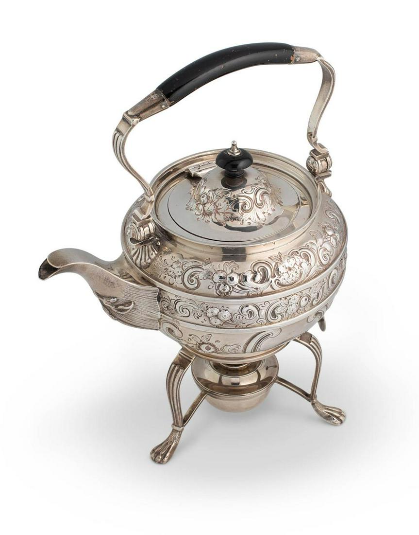 An Edward VII silver tea kettle and stand, mark of Charles Stuart Harris, London 1905, the kettle of: An Edward VII silver tea kettle and stand, mark of Charles Stuart Harris, London 1905, the kettle of circular form, lavishly decorated with three bands of repoussÃ© foliage around a scroll edged vac