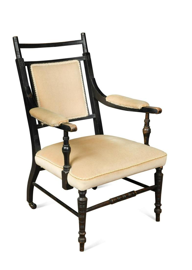 An Aesthetic movement elbow chair in the manner of E. W. Godwin (1833-1886), (1 of 1)