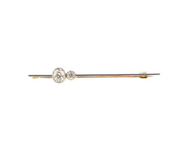 A diamond set bar brooch,: A diamond set bar brooch, rubover set oval shaped old brilliant cut diamond, estimated approximate weight 0.50ct, further set with an old brilliant cut diamond, estimated approximate weight 0.11ct,