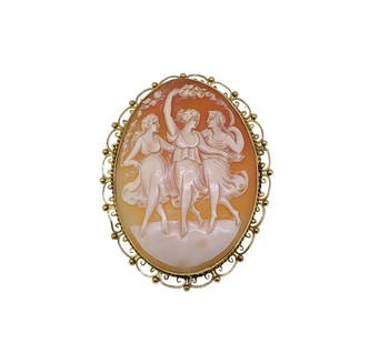 A cameo brooch,: A cameo brooch, shell cameo depicting the three graces, decorative scroll border, dimensions 7 x 5.5cm, pin and hook fitting with safety chain, unhallmarked, stamped '9CT', weight 24g