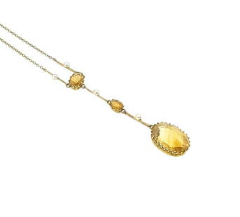 An early 20th century citrine and pearl Edna May style necklace,: An early 20th century citrine and pearl Edna May style necklace, trace link chain, suspending a central drop pendant section, set with four pearls and three oval faceted citrine, the largest being