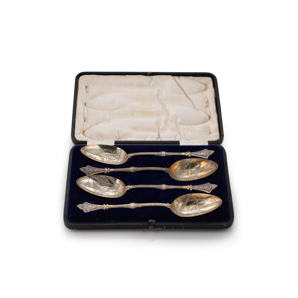 A cased set of four Victorian silver gilt serving spoons,: A cased set of four Victorian silver gilt serving spoons, mark of Elkington & Company (Frederick Elkington), Birmingham 1879, each bowl engraved with foliage and a bird in flight, the stem decorated w