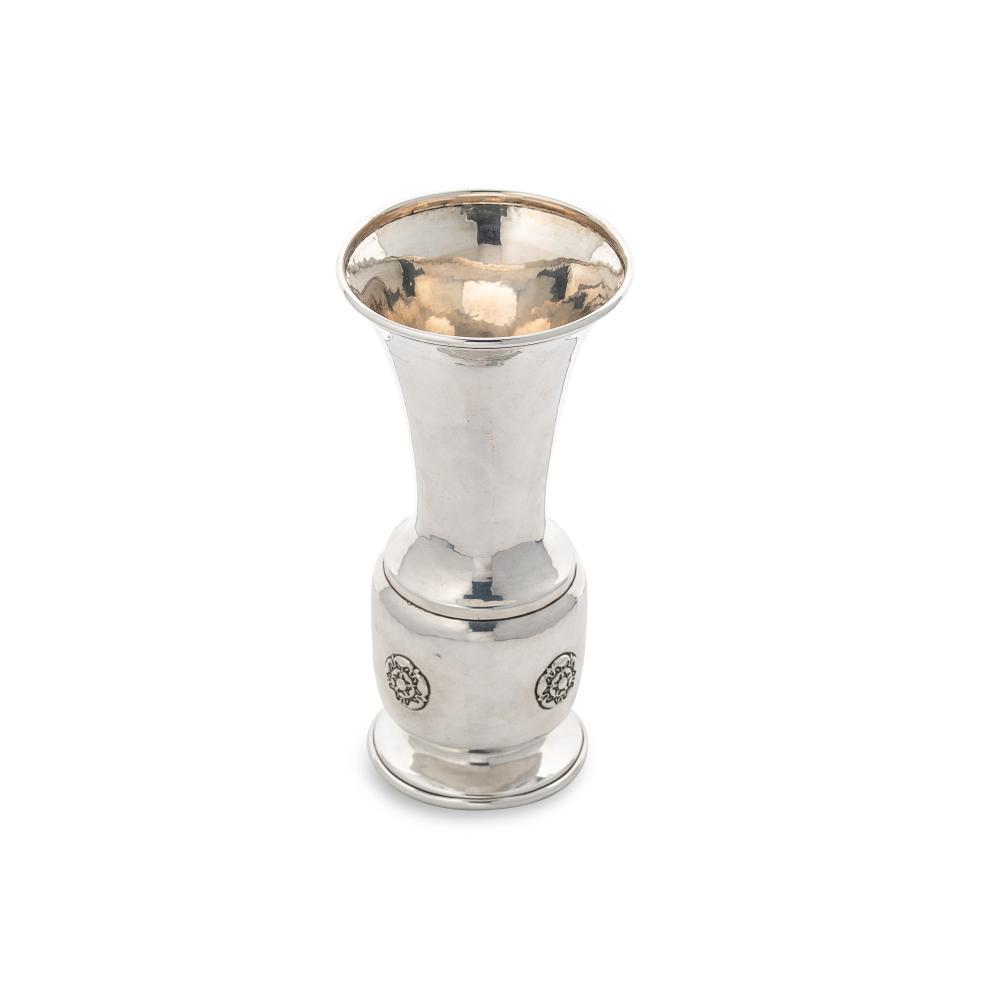 A George V silver ‘Arts & Crafts’ style trumpet vase, mark of A.E. Jones,: A George V silver ‘Arts & Crafts’ style trumpet vase, mark of A.E. Jones, Birmingham 1920, of tapered cylindrical form with hammered finish, flared upper with turned rim, barrel shaped low