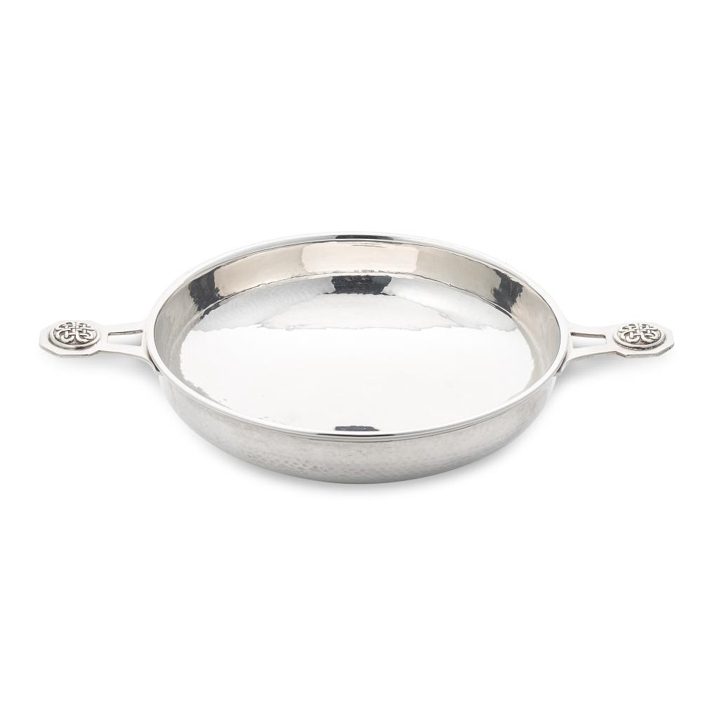 A George V silver ‘Arts & Crafts’ style dish, mark of A.E. Jones,: A George V silver ‘Arts & Crafts’ style dish, mark of A.E. Jones, Birmingham 1933, Jubilee marked, of circular and rather convex form with hammered finish, turned rim and 2 applied and pie